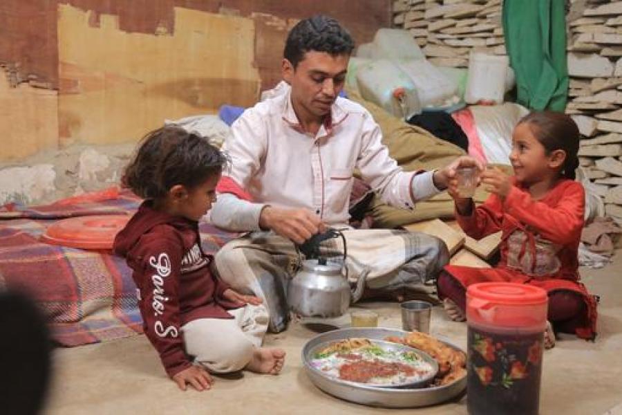 Waleed Al- Ahdal, a simple man who lives in Aljufainah IDPs camp, is preparing the Iftar for him and his kids to break the fasting in Ramadan.    