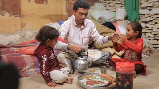 Waleed Al- Ahdal, a simple man who lives in Aljufainah IDPs camp, is preparing the Iftar for him and his kids to break the fasting in Ramadan.    
